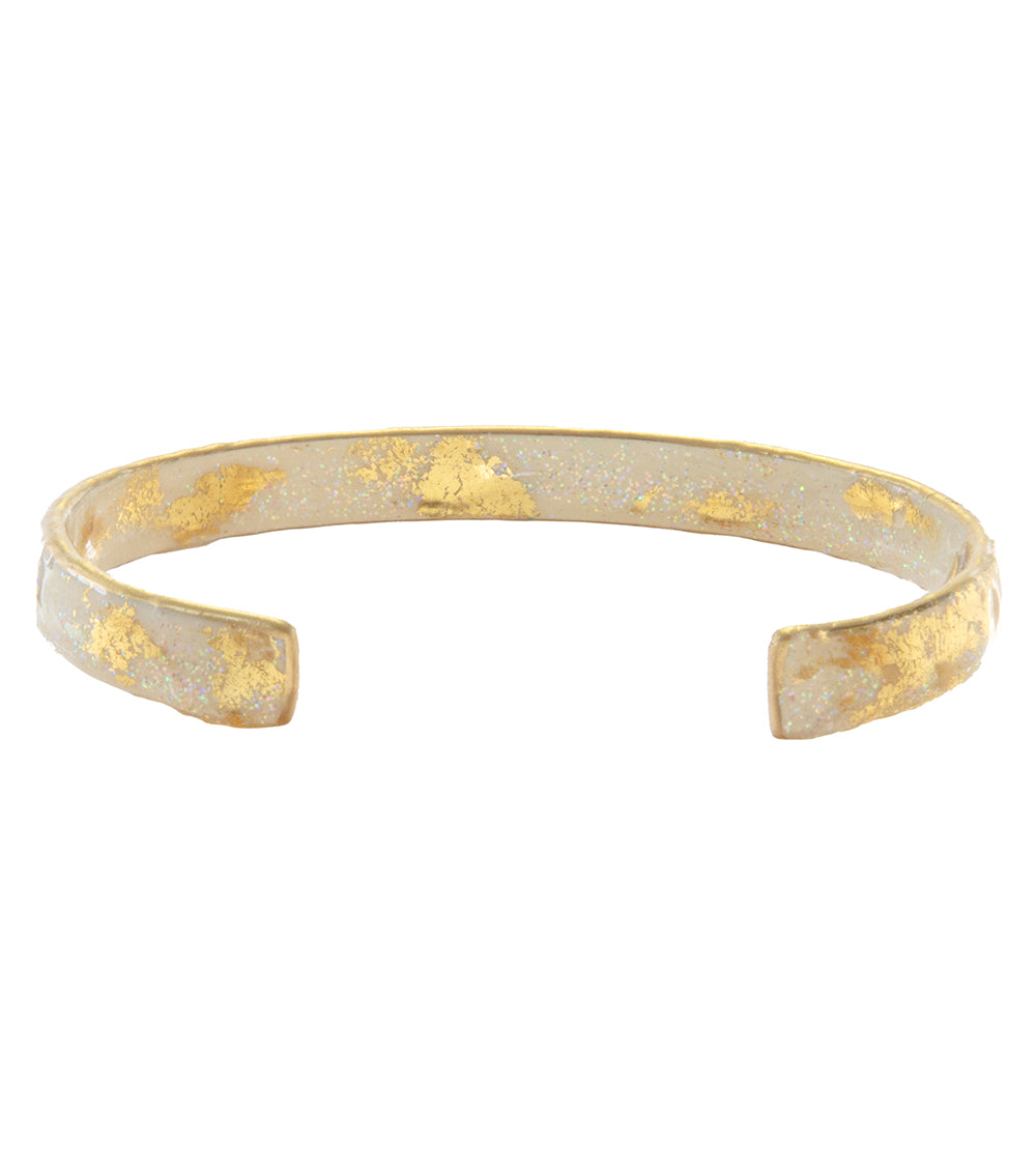 Brazalete apilable con hojas de oro iridiscentes y crema deslumbrante