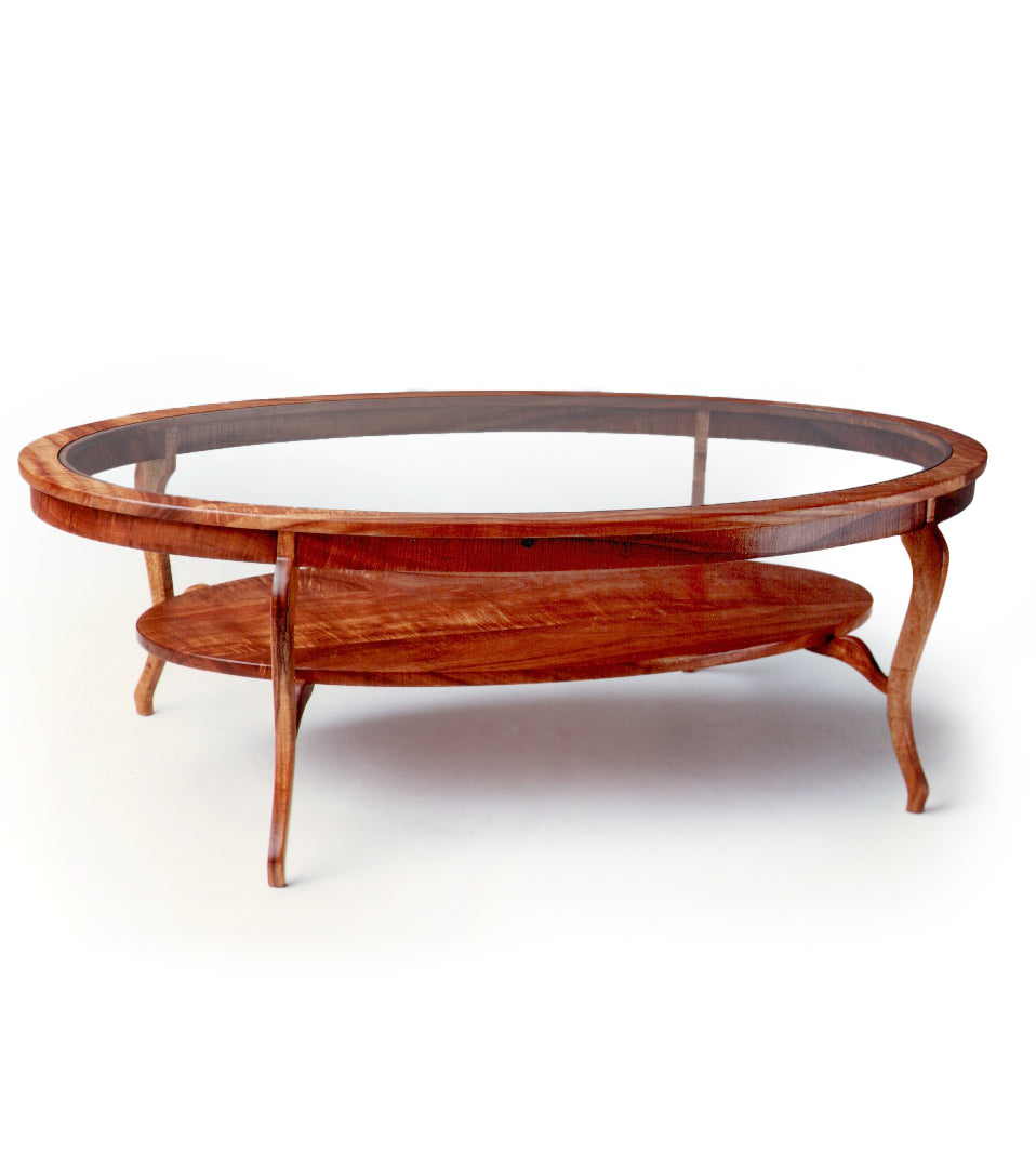Oval Coffee Table. Glass Top. Corbel Koa Shelf